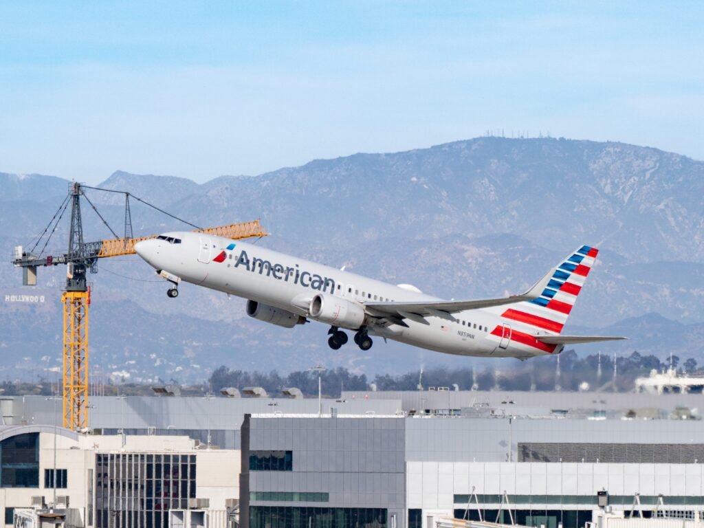 An American Airlines plane was engulfed in plumes of black smoke after an engine fire at Denver airport