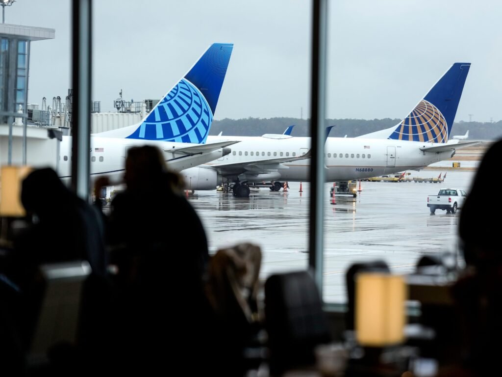 A United Airlines passenger says a pilot forced him from an airplane bathroom for taking too long. Now he's suing.