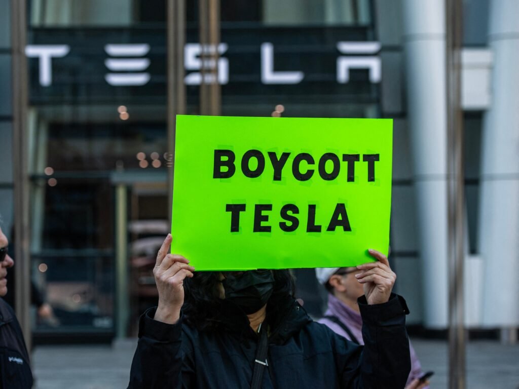 Tesla sent a video to sales staff before protests that featured smiling workers, a dog, and a reminder to 'stay vigilant'