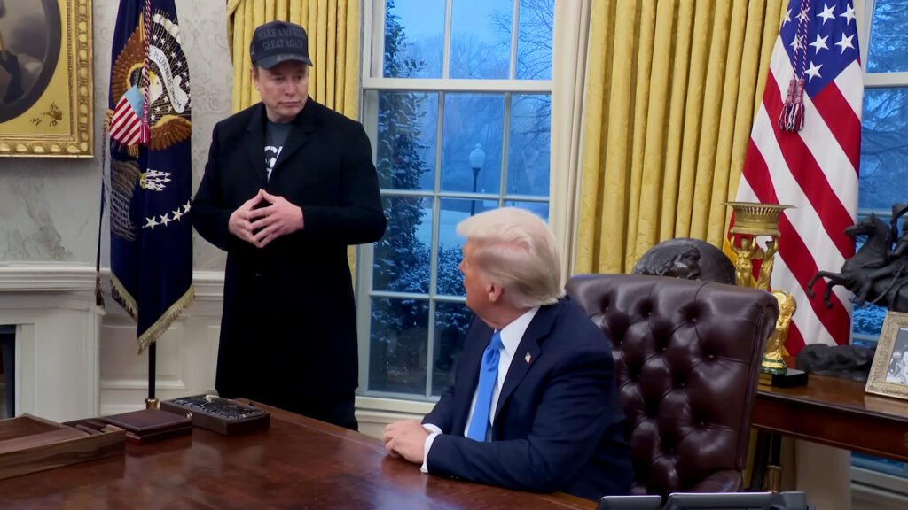 Photo Shows Trump Reading Tesla Pitch From Musk’s New White House Pop-Up Store