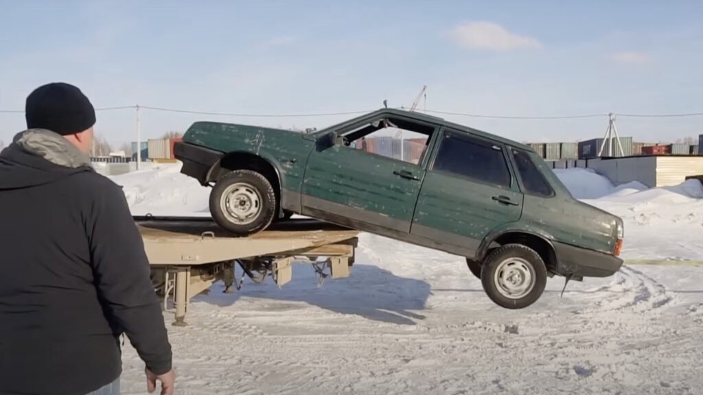 Here's What Happens When You Forget To Strap A Car To A Flatbed
