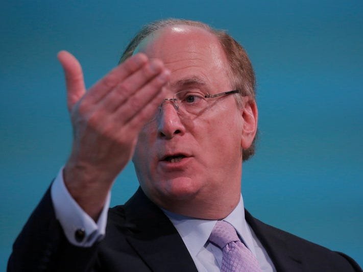 Larry Fink says we are 'probably' in a recession, but don't sell your stocks just yet
