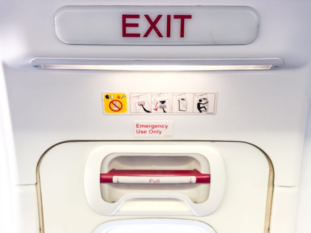 A man tried twice to open the doors of a plane in midair before being restrained by passengers and crew, police say