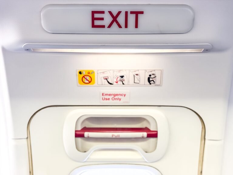 A man tried twice to open the doors of a plane in midair before being restrained by passengers and crew, police say