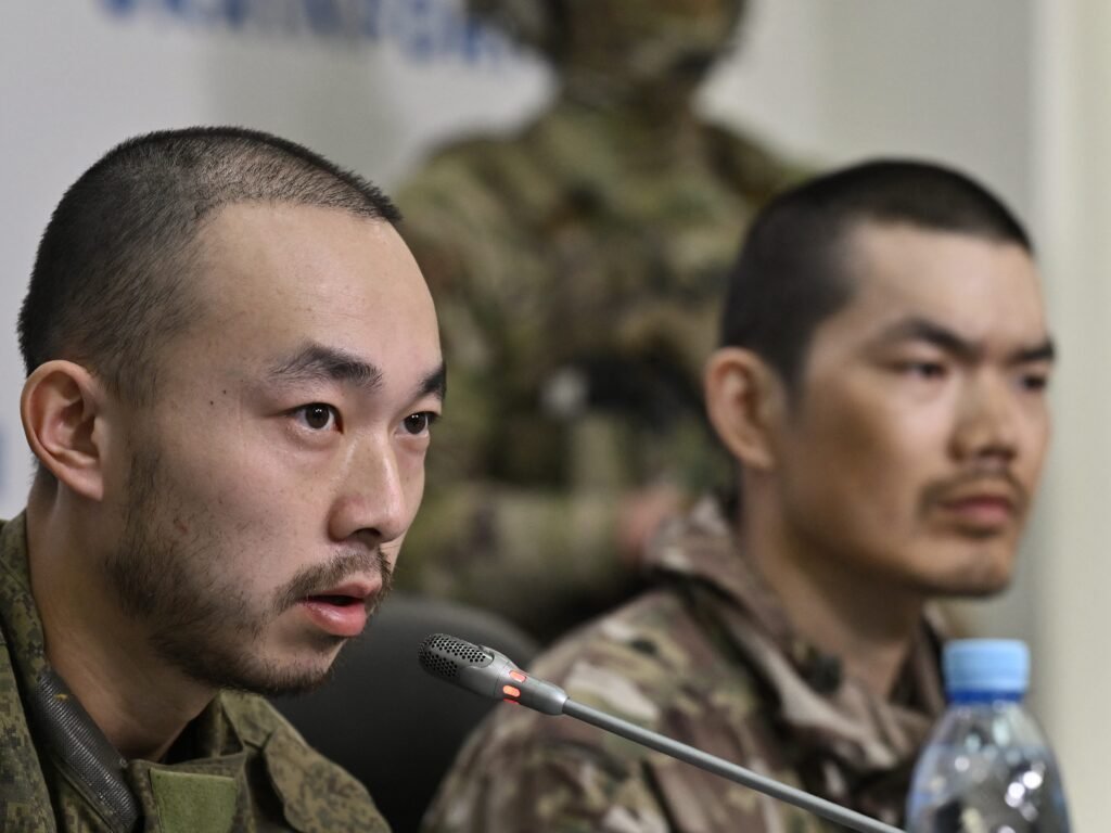 A Chinese man who said he fought for Russia said he couldn't even go to the bathroom without an armed escort