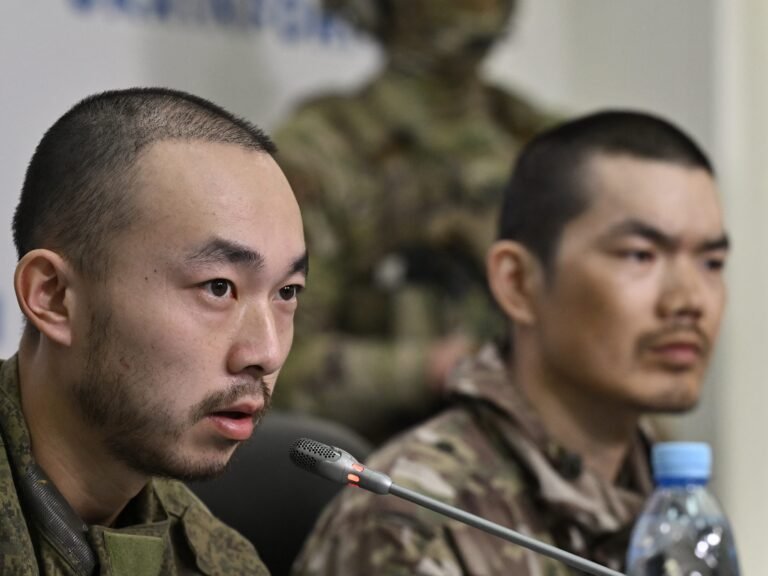 A Chinese man who said he fought for Russia said he couldn't even go to the bathroom without an armed escort