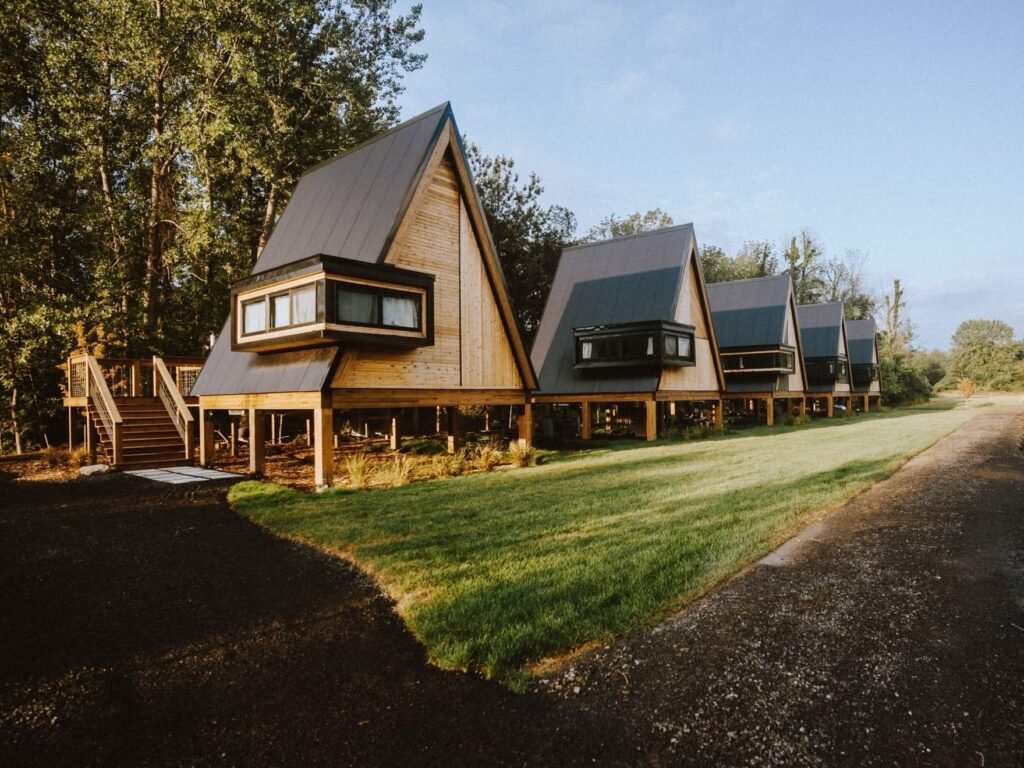 A couple started out renting a bedroom on Airbnb to pay the mortgage. Now their cabin village makes over $30,000 a month.