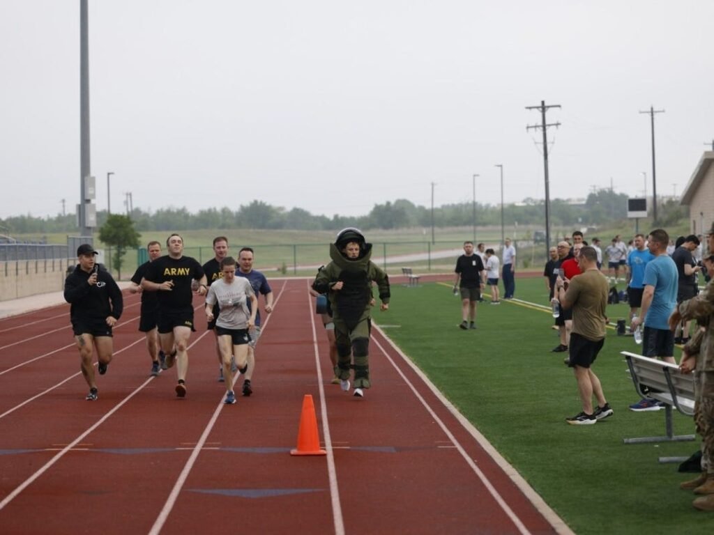 A US Army officer who handles explosives broke the world record for the mile run in a bomb suit. He was 20 seconds faster.