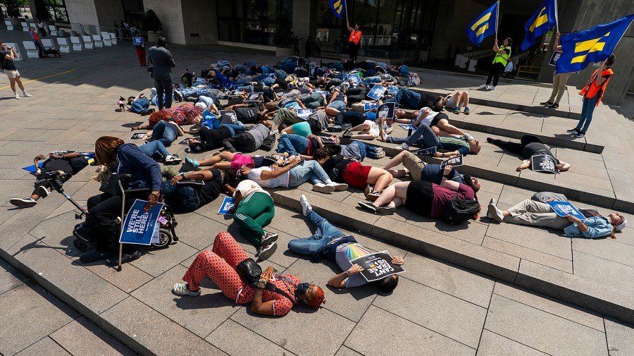 Demonstrators stage ‘die-in’ at HHS to protest cuts to HIV programs