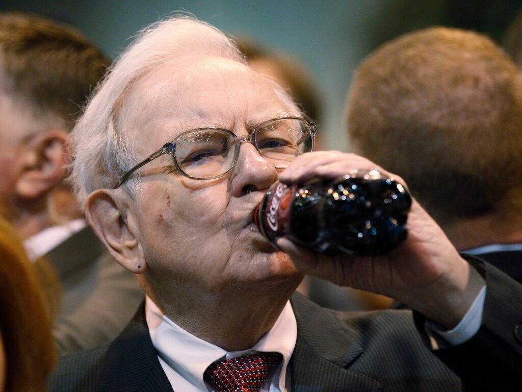 Warren Buffett defends his love of Coke and lack of exercise, noting that he's still here at 94