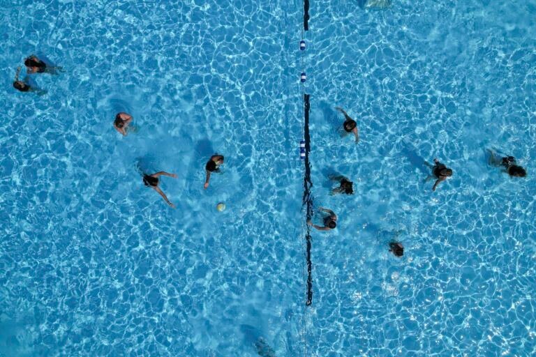 The pool's open. Trump's laid off the team that helps protect swimmers.