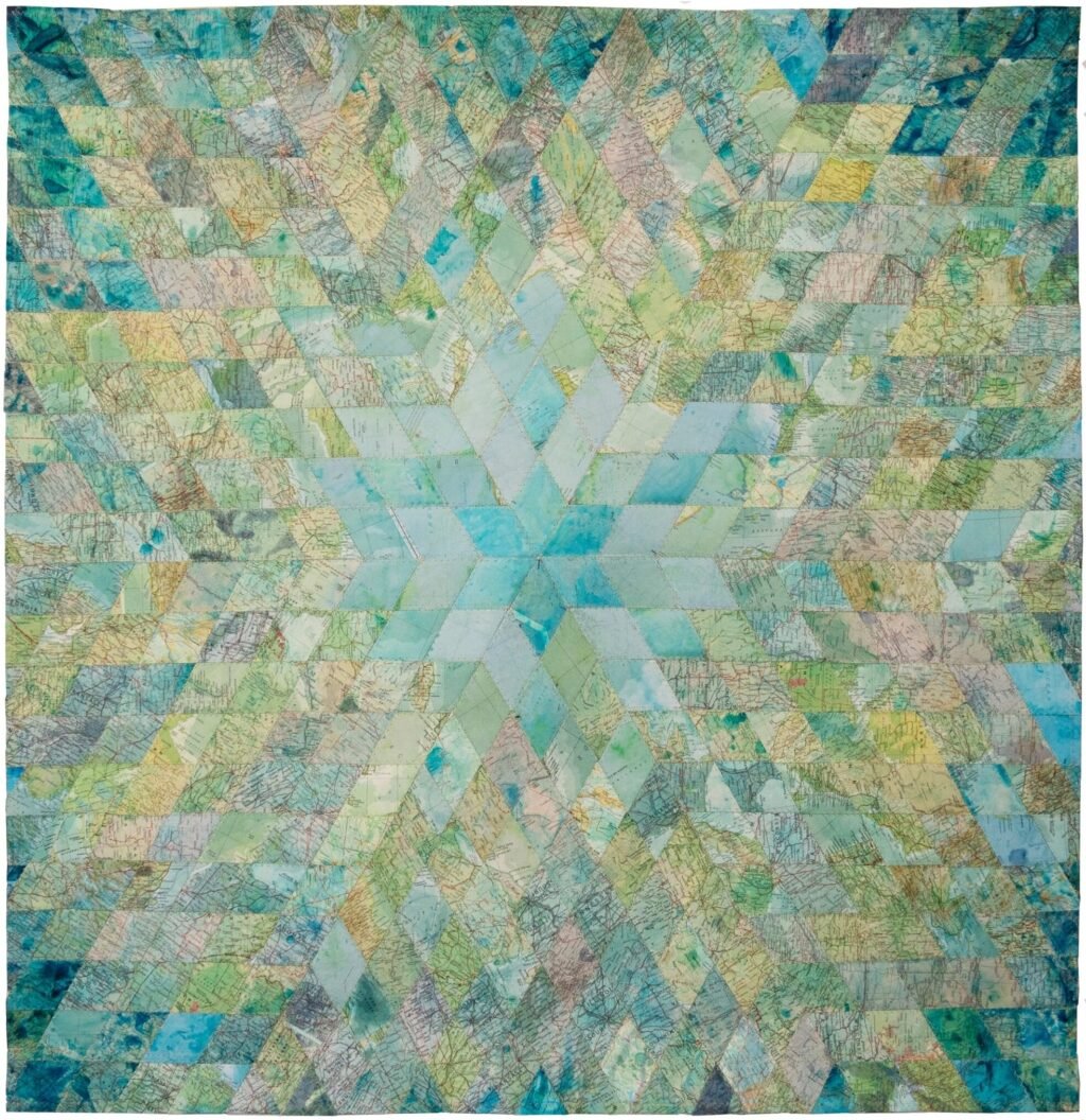Faith XLVII Sews Textiles Made from World Maps and Currency to Explore the ‘Veins of the World’