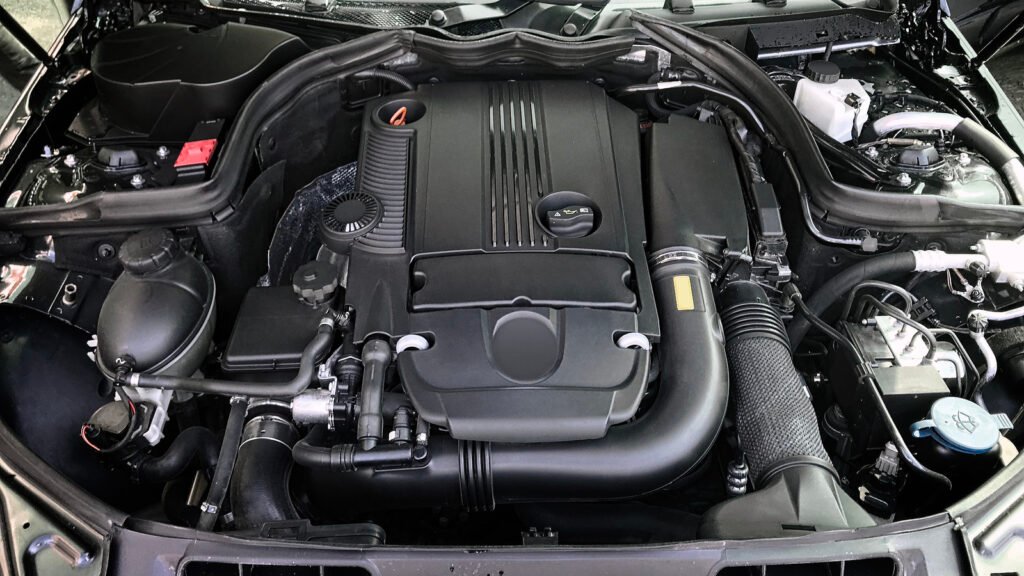 Your Car's Engine Bay Is A Plastic Mess And Here's Why