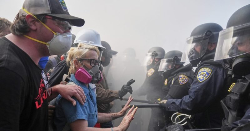 Man handcuffed for allegedly giving out face shields to 'suspected rioters' at LA protest
