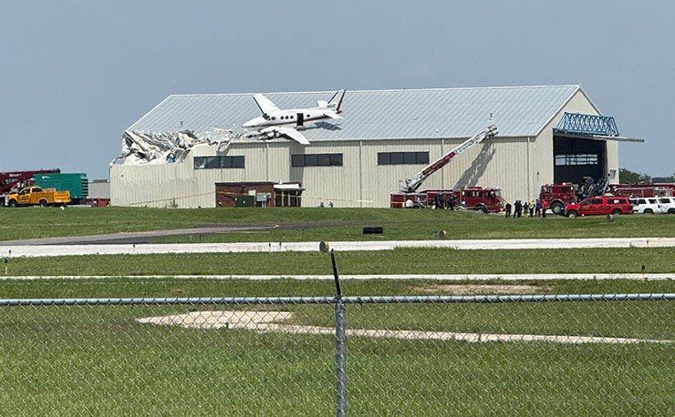Small plane crashes onto hangar roof at Kansas airport