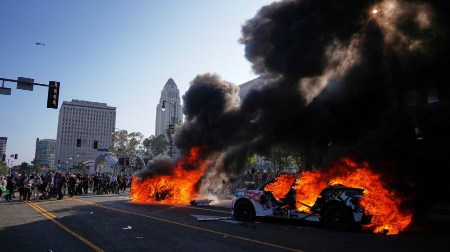 Waymo halts service in LA after robotaxis set ablaze