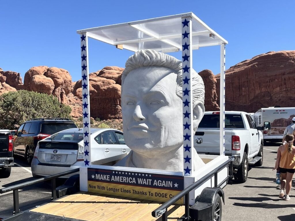 A giant Elon Musk bust was spotted at a Utah national park with a sign calling out DOGE cuts