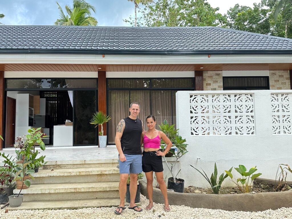 Their lives used to revolve around city traffic. They gave it up to build an island home in the Philippines for $85,000.