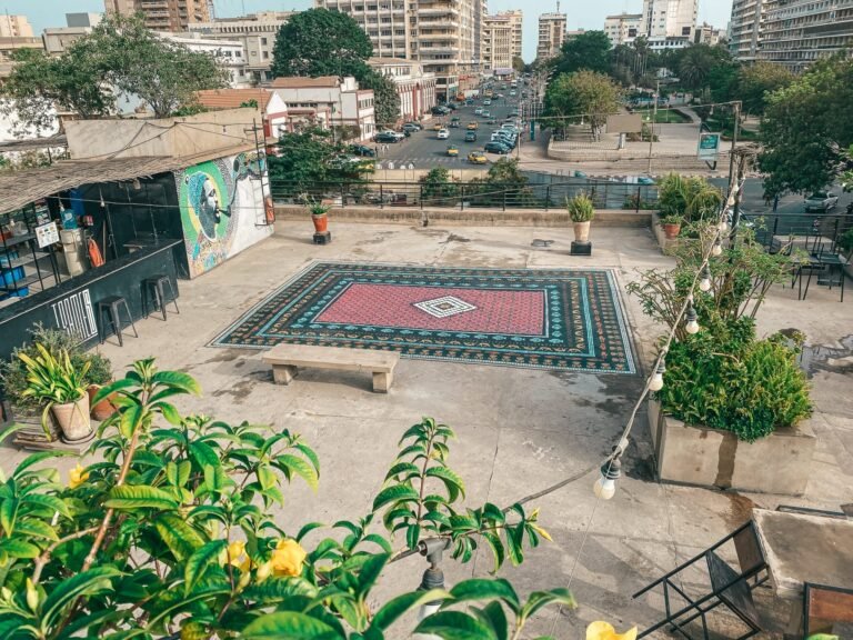 An Ornate Stenciled Rug by Mateo Complements a Cultural Center’s Communal Rooftop in Dakar
