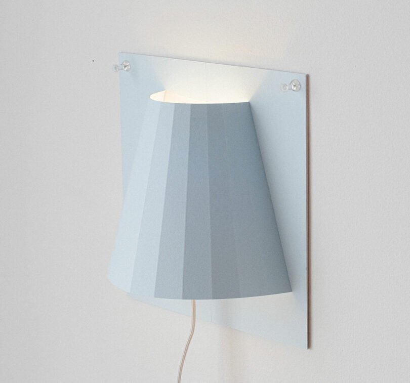 A Minimalist Paper Sconce That Hangs With Just Push-Pins