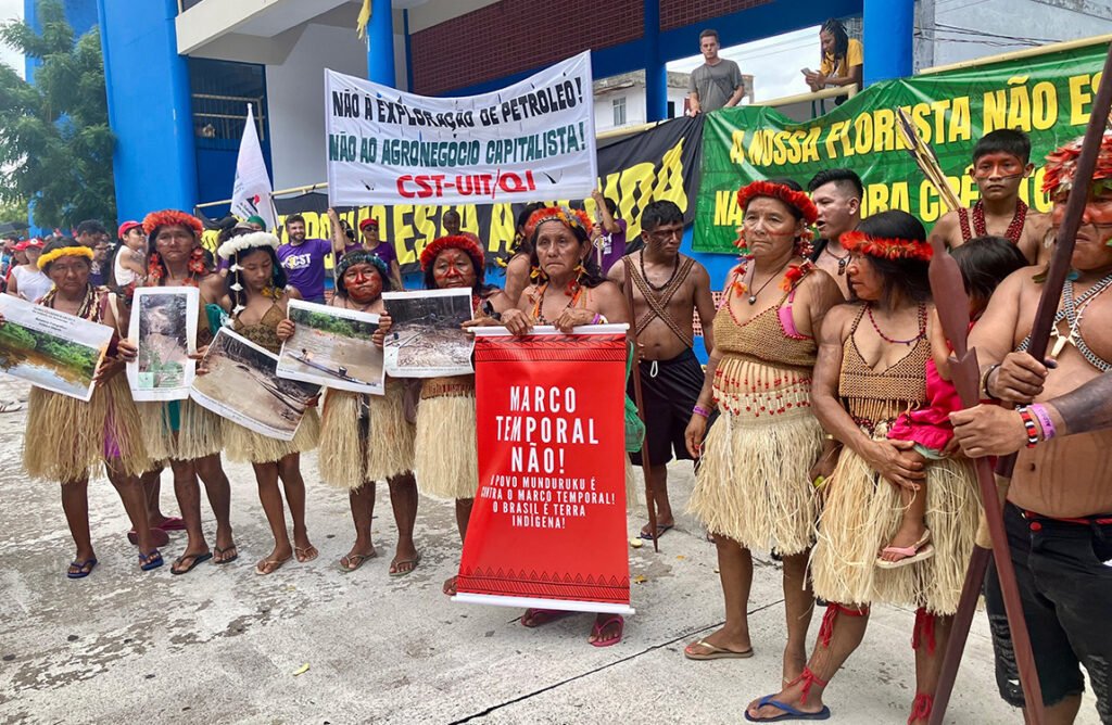 Protests return to climate summit with calls for Indigenous rights (and a dash of Trump mockery)