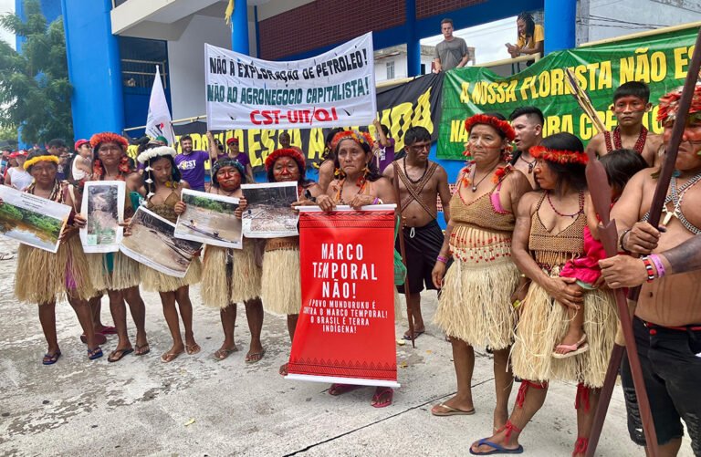Protests return to climate summit with calls for Indigenous rights (and a dash of Trump mockery)