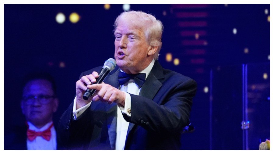 Trump plays auctioneer in New Year's charity auction