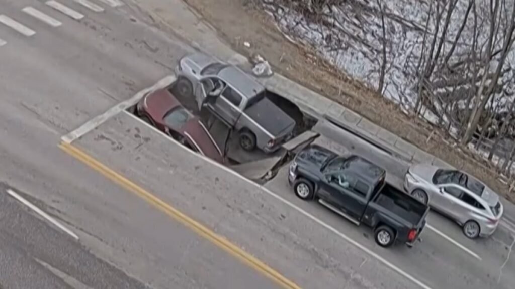 Watch as Nasty Sinkhole Swallows Up Two Vehicles at Omaha Intersection