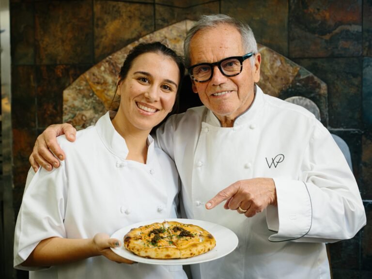 I cooked with Wolfgang Puck at Spago. He showed me how to make his famous pizza.