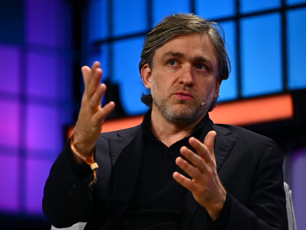 This CEO spent years betting on remote work. Now he's evolving his stance because of AI.