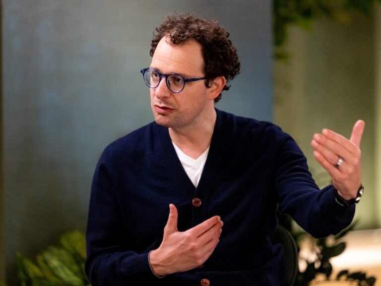 Anthropic CEO says an 'intrinsic' feature of AI may be fewer jobs. His answer? Redistribute the upside.