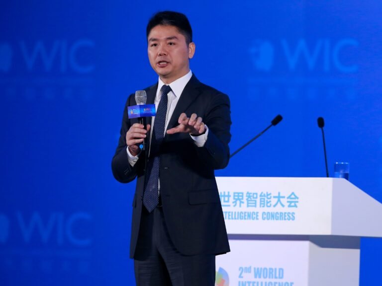 The founder of China's Amazon wants his 700,000 blue-collar workers to be 'white-collarized' in time for AI