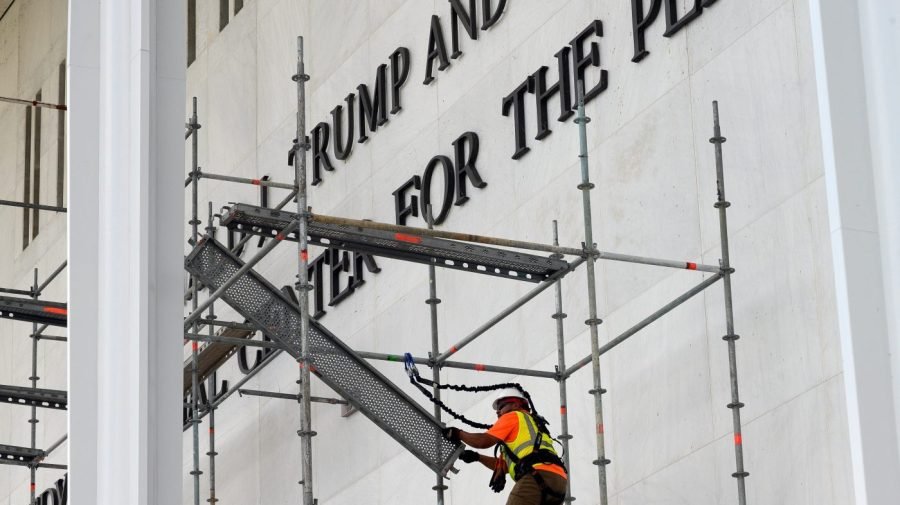 Crews begin stripping Trump name from Kennedy Center after court ruling, weather delay