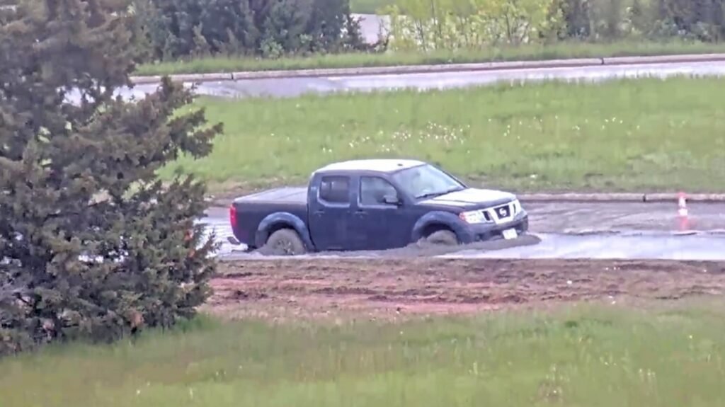 Pickup Truck Driver Moves 'Road Closed' Sign, Immediately Gets Stuck In Wet Concrete