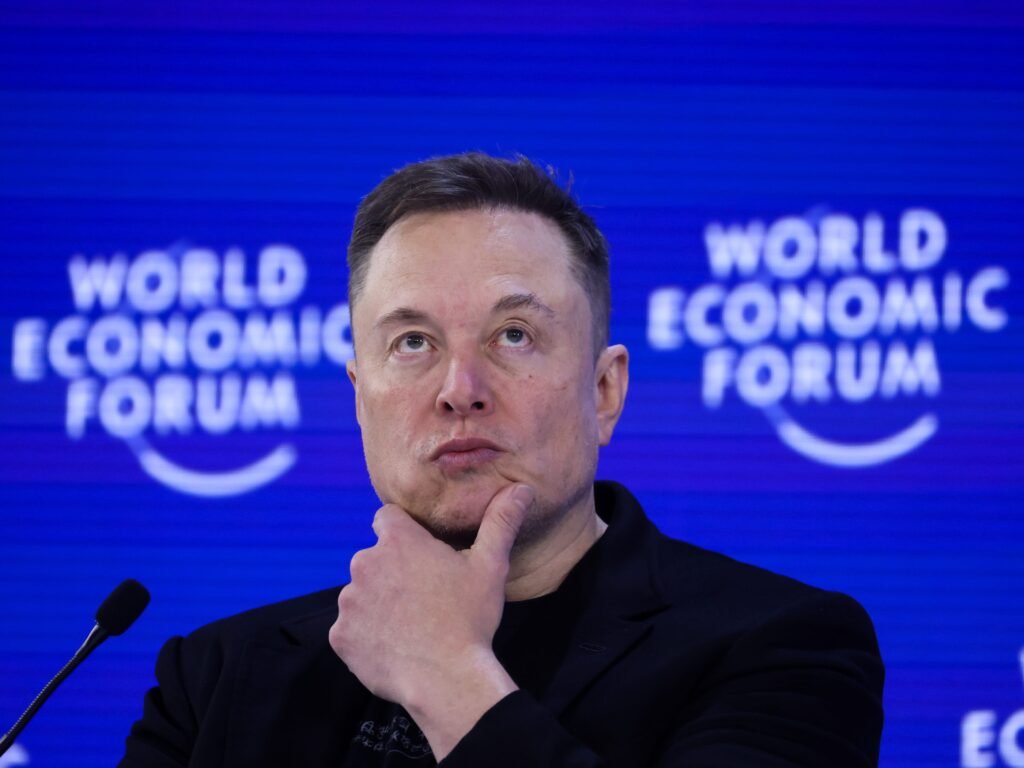 Elon Musk says Tesla should be spending on AI 'as fast as we can'