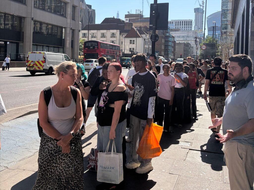 The hottest thing to do in London today is wait in line for solar eclipse glasses