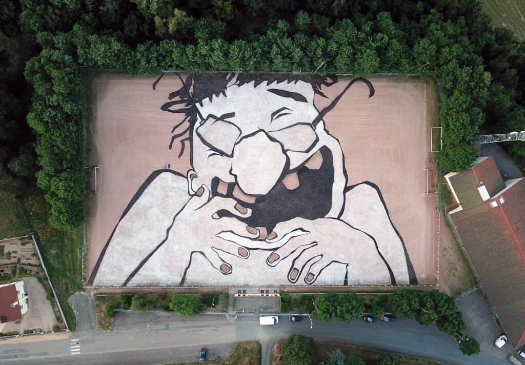 Monumental Joyful Murals by Ella & Pitr Fill Urban Rooftops and Fields