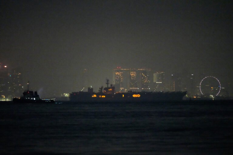 USS Abraham Lincoln sails past Singapore on way home from Middle East