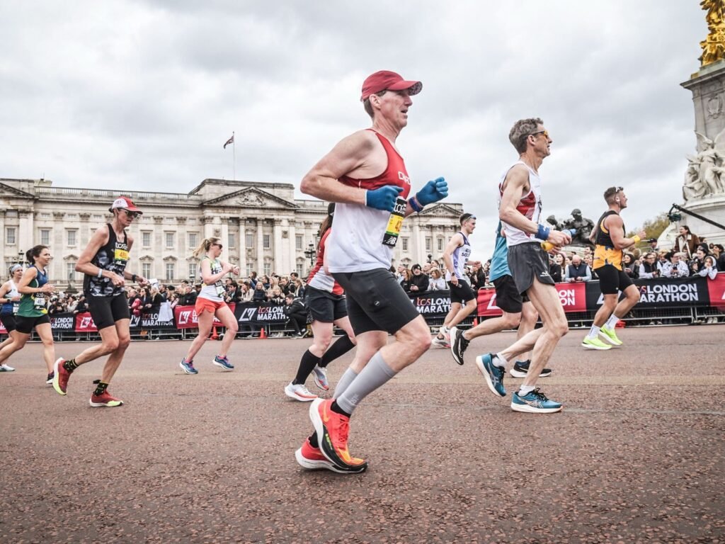 One runner spent $40,000, another took a second job. Marathoners are making big sacrifices to chase medals worldwide.