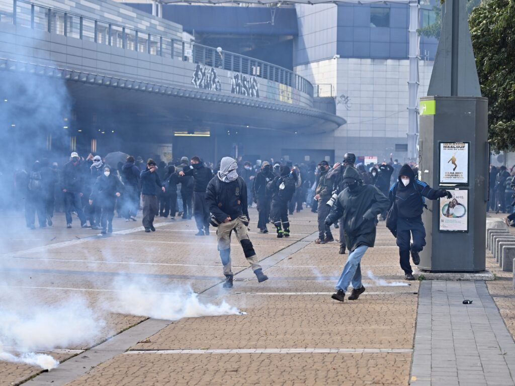 Chaos and looting roiled major cities as Europeans poured into the streets to protest rising living costs